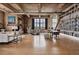 Open-concept living space featuring exposed ductwork, large windows, built-in shelving, and contemporary furnishings at 2000 Little Raven St # 4A, Denver, CO 80202
