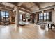 Spacious living room with a hardwood floor, fireplace, modern decor, and multiple large windows at 2000 Little Raven St # 4A, Denver, CO 80202