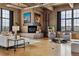 Living room boasts a fireplace with art, jukebox, ample seating, large window, and industrial style at 2000 Little Raven St # 4A, Denver, CO 80202