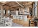 Spacious living room and kitchen area in a modern loft with industrial ceilings at 2000 Little Raven St # 4A, Denver, CO 80202