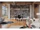 Open living area with a large bookcase, desk, and oversized windows for a bright workspace at 2000 Little Raven St # 4A, Denver, CO 80202