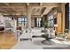 Inviting living room with hardwood floors, a white sofa, and large windows for natural light at 2000 Little Raven St # 4A, Denver, CO 80202