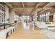 Open living area featuring hardwood floors, concrete pillars, and large windows with city views at 2000 Little Raven St # 4A, Denver, CO 80202