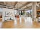 Open living space with concrete pillars, hardwood floors, modern kitchen, and dining space at 2000 Little Raven St # 4A, Denver, CO 80202