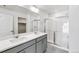 Modern bathroom with double vanity and walk-in shower at 13432 Wabash St, Thornton, CO 80602