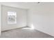 Well-lit bedroom with carpet and a window offering a view at 13432 Wabash St, Thornton, CO 80602