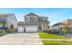 Two-story house with gray siding, white trim, and a two-car garage at 13432 Wabash St, Thornton, CO 80602