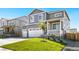 Two-story house with gray siding, white trim, and a two-car garage at 13432 Wabash St, Thornton, CO 80602