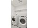 Laundry room with side-by-side washer and dryer at 13432 Wabash St, Thornton, CO 80602