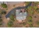 Aerial view of the property shows the roof and the surrounding landscape at 30205 Telluride Ln, Evergreen, CO 80439
