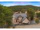 Beautiful view of the attractive two-story home surrounded by lush greenery at 30205 Telluride Ln, Evergreen, CO 80439