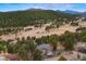 An aerial of a beautiful luxury home and lush surroundings at 30205 Telluride Ln, Evergreen, CO 80439