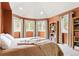 Inviting bedroom with lots of natural light, neutral colors and scenic views from multiple windows at 30205 Telluride Ln, Evergreen, CO 80439