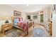 Charming bedroom featuring a wood frame bed, colorful decor and natural light at 30205 Telluride Ln, Evergreen, CO 80439