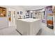 Spacious craft room with large table, ample lighting, and a serene atmosphere, perfect for hobbies at 30205 Telluride Ln, Evergreen, CO 80439