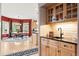 Bright kitchen featuring custom cabinetry, granite counters, stainless faucet and a view into the breakfast nook at 30205 Telluride Ln, Evergreen, CO 80439