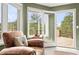 Cozy living room features oversized windows, door to deck and comfortable seating at 30205 Telluride Ln, Evergreen, CO 80439