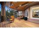 A furnished deck with a covered patio and scenic views, perfect for relaxing and entertaining at 30205 Telluride Ln, Evergreen, CO 80439