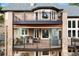 Multi-tiered deck perfect for outdoor dining and entertaining, with beautiful stonework at 30205 Telluride Ln, Evergreen, CO 80439