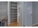 Hallway featuring access to bedrooms, a closet, and updated flooring at 3355 S Flower St # 166, Lakewood, CO 80227
