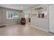 Spacious open-plan living and kitchen area with large windows for natural lighting at 3355 S Flower St # 166, Lakewood, CO 80227