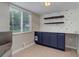 Living room featuring modern lighting, a built-in bar with shelves, and a large window at 3355 S Flower St # 166, Lakewood, CO 80227