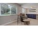 Bright living room with sleek flooring, a cozy chair, and a built-in cabinet and shelving at 3355 S Flower St # 166, Lakewood, CO 80227