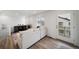 Bright living room with wood-look floors, neutral colors, and lots of light at 13543 E 103Rd Ave, Commerce City, CO 80022