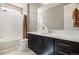 Well-lit bathroom featuring a large vanity, a shower-tub combo, and modern fixtures for a clean, updated look at 10179 E 59Th North Pl, Denver, CO 80238