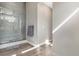 Modern bathroom with a glass-enclosed shower, sleek fixtures, and stylish tile flooring for a spa-like feel at 10179 E 59Th North Pl, Denver, CO 80238