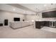 Spacious basement living room with a comfortable sofa and convenient wet bar at 10179 E 59Th North Pl, Denver, CO 80238