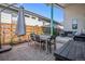 Back patio includes outdoor dining set and grill, perfect for entertaining at 10179 E 59Th North Pl, Denver, CO 80238