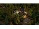 Aerial view of home featuring lush green trees surrounding the property and long driveway at 5159 Serene View Way, Parker, CO 80134