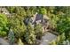 Stunning aerial shot of a secluded home surrounded by lush greenery and mature trees at 5159 Serene View Way, Parker, CO 80134