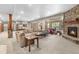 Finished basement living area features a stone fireplace, large sectional and entertaining space at 5159 Serene View Way, Parker, CO 80134
