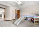 Bedroom featuring an elevated bed with slide and doorway leading to closet and hallway at 5159 Serene View Way, Parker, CO 80134