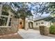 Beautiful stone and stucco home featuring a charming front porch and inviting entrance at 5159 Serene View Way, Parker, CO 80134