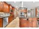 Modern kitchen features stainless steel appliances, granite counters, and plenty of cabinet space at 5159 Serene View Way, Parker, CO 80134