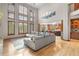 Bright, open-concept living room with soaring ceilings and floor-to-ceiling windows at 5159 Serene View Way, Parker, CO 80134