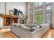 Sunny living room with a stone fireplace and walls of windows at 5159 Serene View Way, Parker, CO 80134