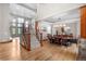 Inviting living room featuring hardwood floors, large windows, and a staircase at 5159 Serene View Way, Parker, CO 80134