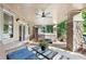 Covered patio with hot tub, comfortable seating and tongue and groove ceiling at 5159 Serene View Way, Parker, CO 80134