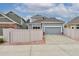 Home showcasing the garage and driveway in the neighborhood at 1518 Whitehall Dr, Longmont, CO 80504