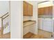Laundry area with washer, dryer, and built in cabinetry at 1518 Whitehall Dr, Longmont, CO 80504
