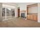 Inviting living room with fireplace and a sliding door to a deck at 1518 Whitehall Dr, Longmont, CO 80504