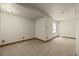 Finished basement with neutral carpet, ample space, and trim at 5010 Apache Creek Rd, Castle Rock, CO 80109