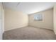 Neutral bedroom features carpet flooring and a window with natural light at 5010 Apache Creek Rd, Castle Rock, CO 80109