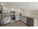 Updated kitchen with stainless steel appliances and granite countertops at 5010 Apache Creek Rd, Castle Rock, CO 80109