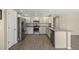 Bright kitchen features stainless steel appliances, granite counters, and wood-look flooring at 5010 Apache Creek Rd, Castle Rock, CO 80109