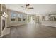 Sunlit living room with a cozy fireplace and sliding door access to the yard at 5010 Apache Creek Rd, Castle Rock, CO 80109